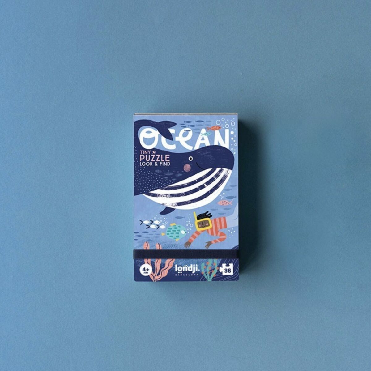 Boîte de poche blanche du Tiny Puzzle Océan de Londji avec illustration d'une baleine et de poissons.