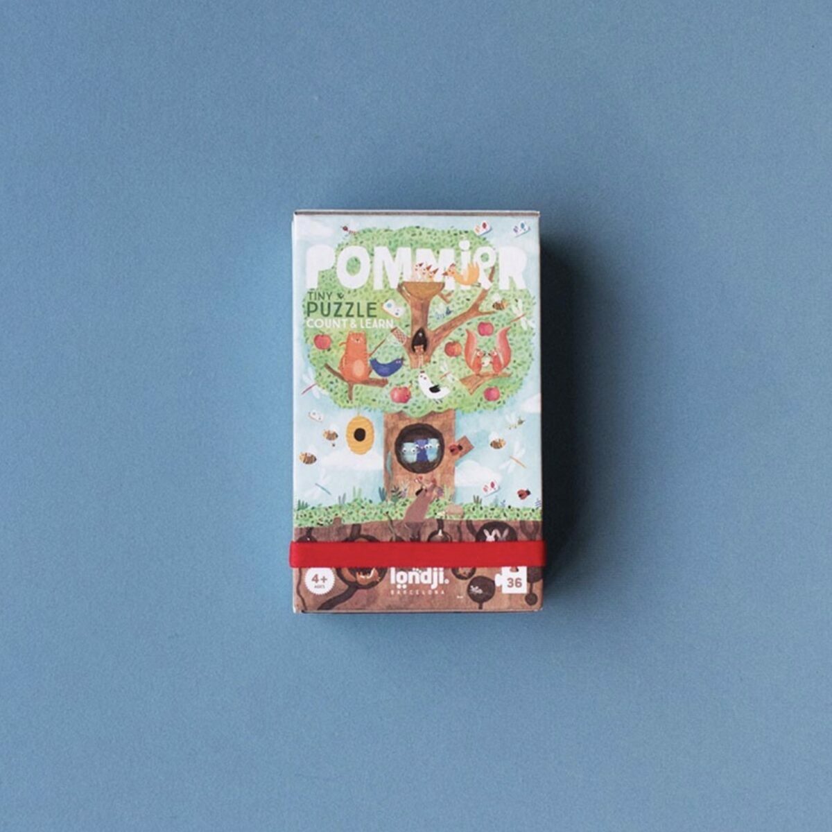 Boîte de poche blanche du Tiny Puzzle Pommier de Londji avec illustration d'un pommier.