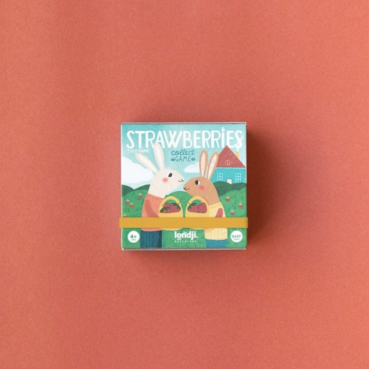 Petite boîte carrée rose du jeu Strawberries de Londji montrant un lapin et un blaireau avec des fraises.