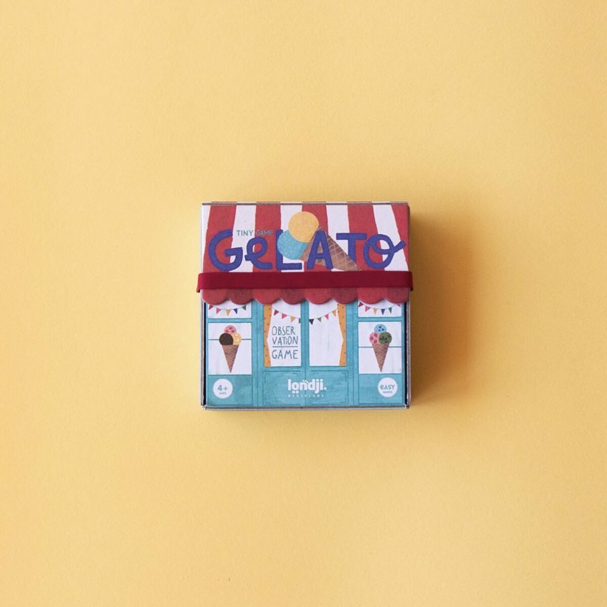 Petite boîte carrée bleue du jeu Gelato de Londji illustrant des boules de glaces colorées avec des yeux et des sourires.
