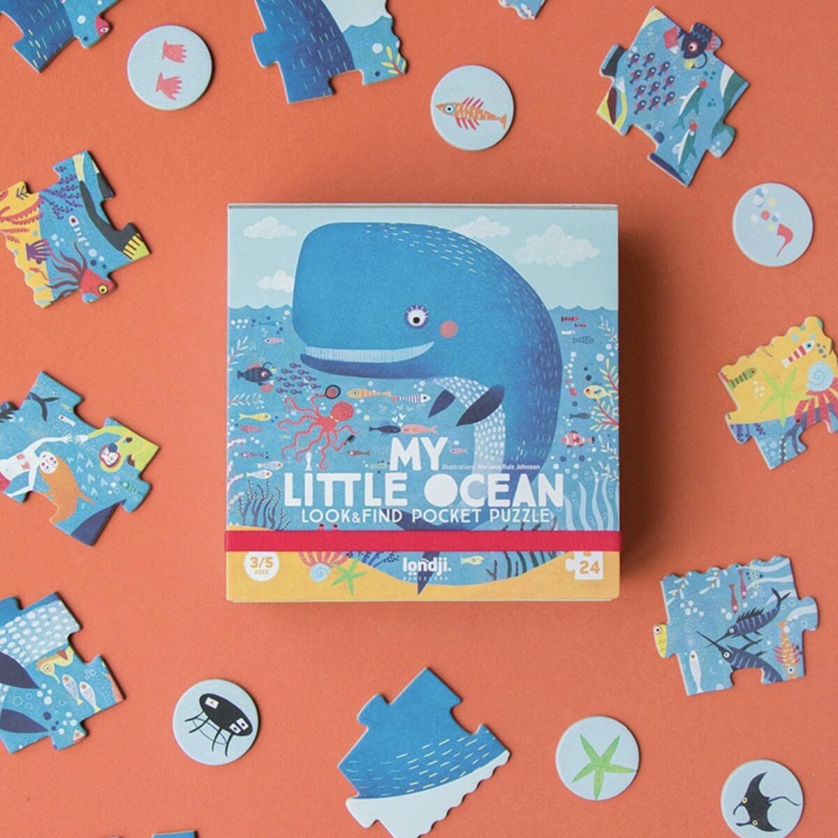 Boîte de poche carrée du puzzle My Little Ocean de Londji montrant une illustration de baleine.