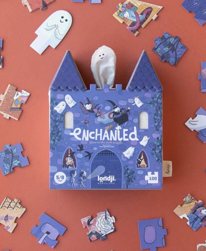 Boîte rectangulaire du puzzle Enchanted de Londji illustrant un fantôme et un monstre devant un château.