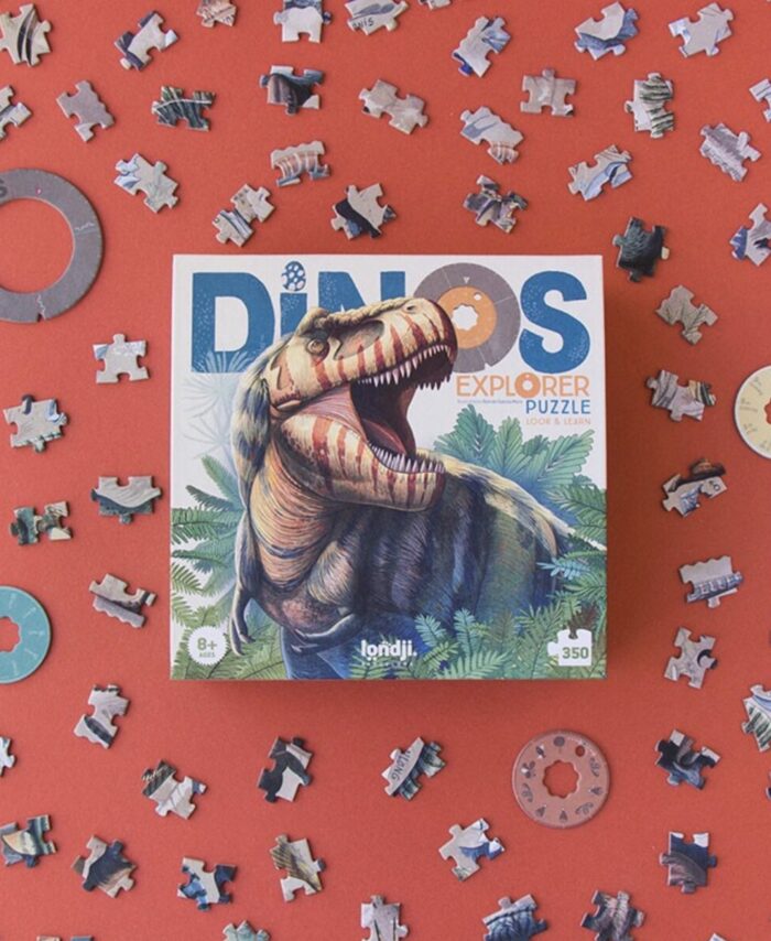 Boîte rectangulaire du puzzle Londji Dinos Explorer illustrant un T-Rex et les disques de données.